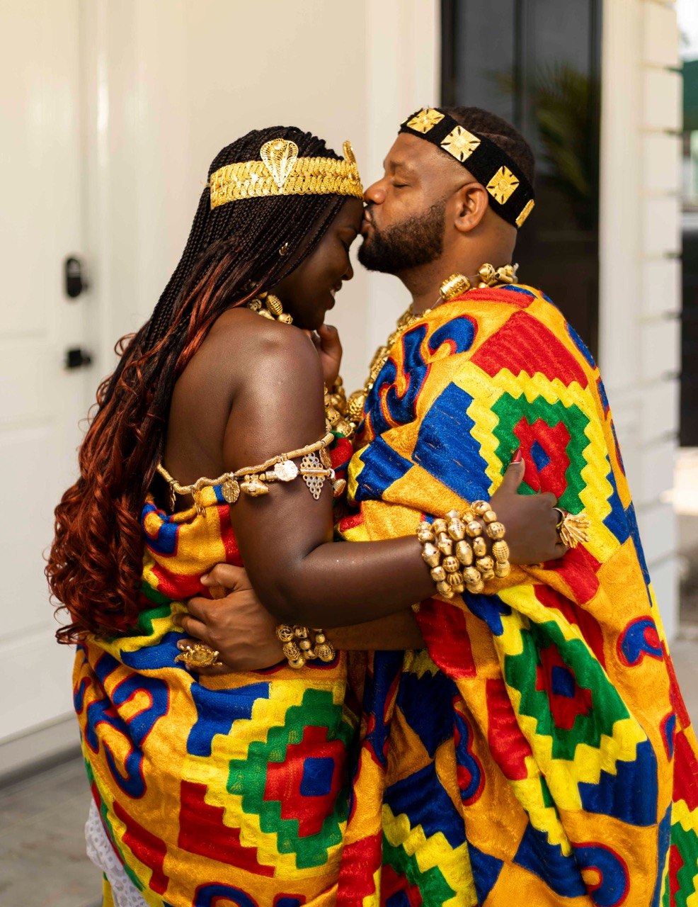 Edward kissing Claudine in traditional attire